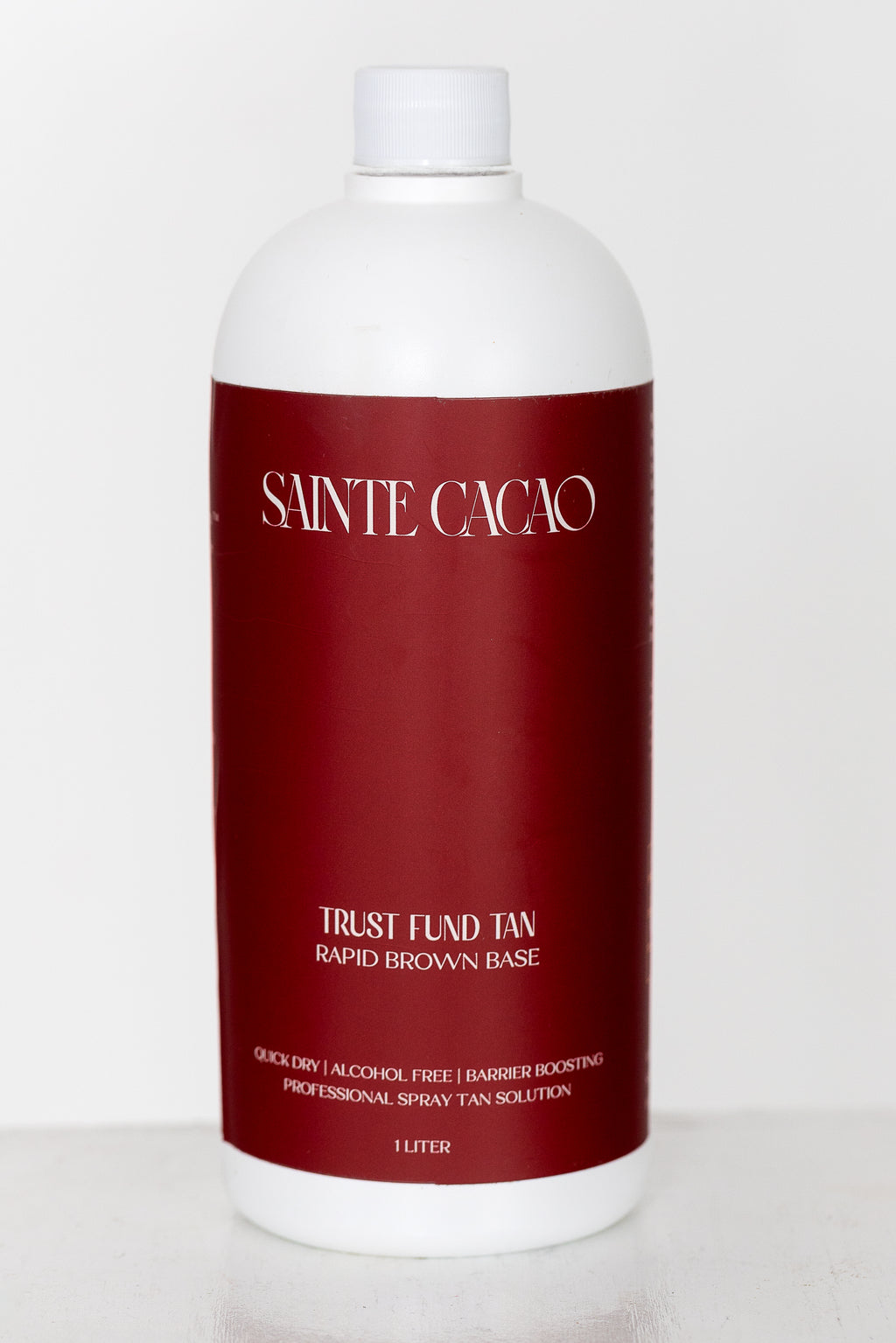 Sainte Cacao Trust Fund Tan 18% DHA professional spray tan solution bottle