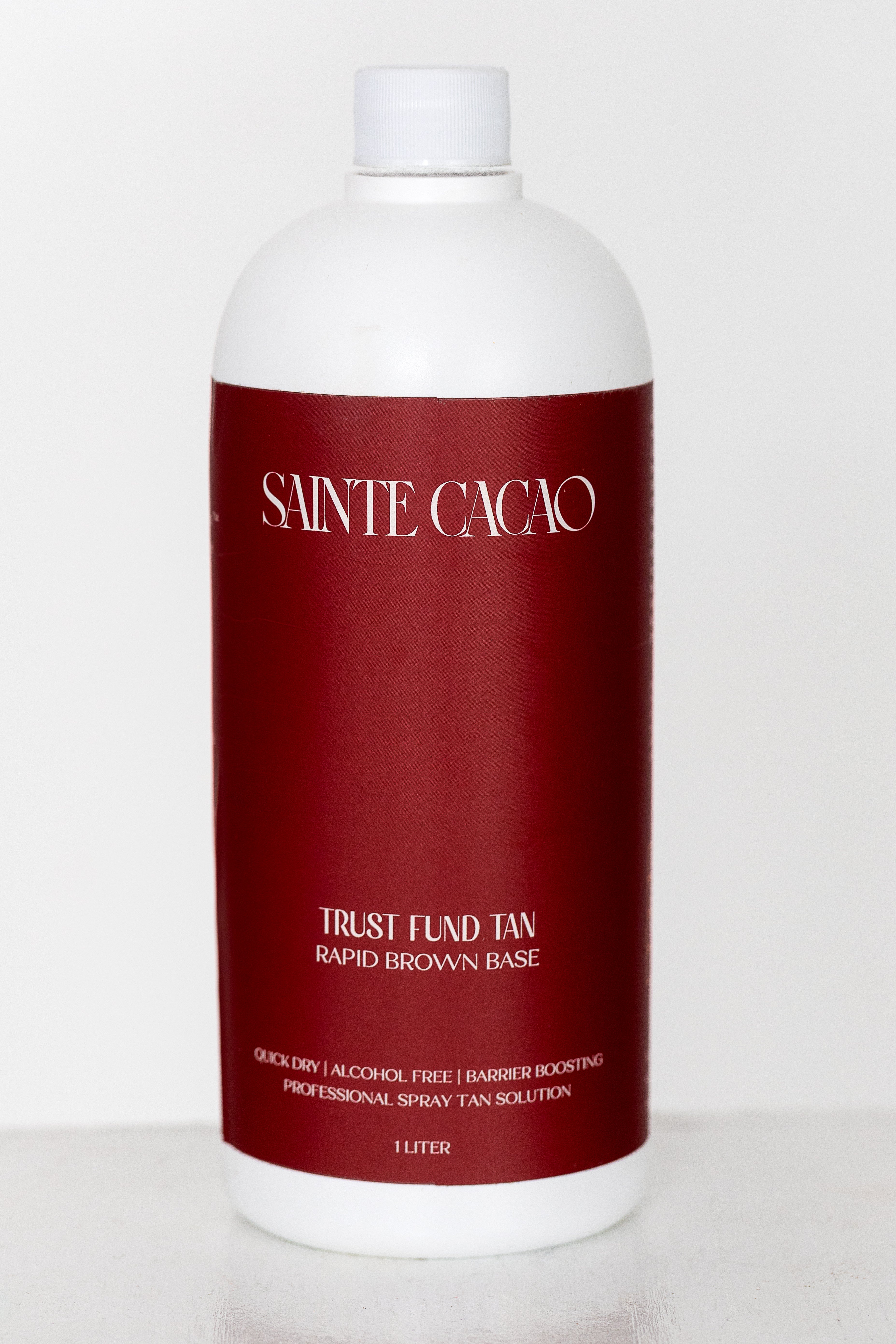 Sainte Cacao Trust Fund Tan 18% DHA professional spray tan solution bottle